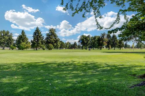 a view of a golf course with trees and grass at Quality Inn Umatilla - Hermiston in Umatilla