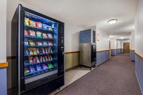 a soda vending machine in a hallway of a building at Quality Inn Umatilla - Hermiston in Umatilla
