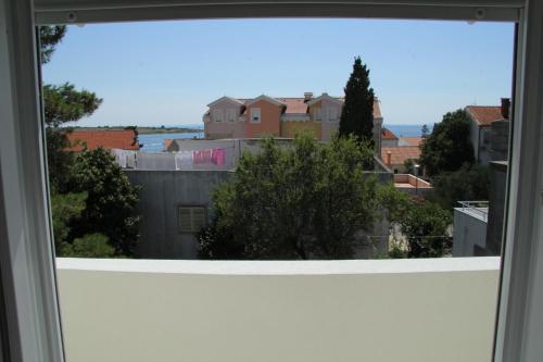 a view of a city from a window at Bed & Breakfast Novalja Inn in Novalja