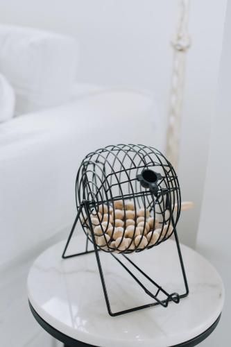 a wire bird cage sitting on top of a table at G Boutique Resort - Santander in Santander