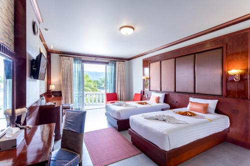 Katil atau katil-katil dalam bilik di Erawan Hotel