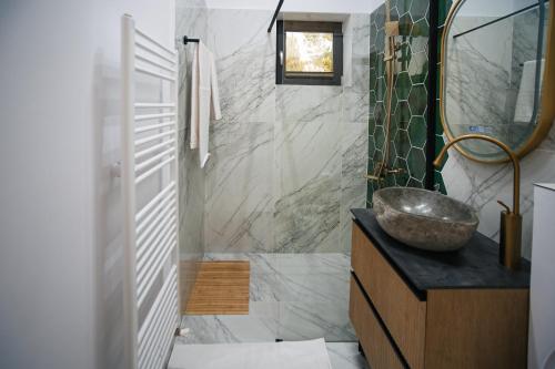 a bathroom with a sink and a mirror at Apuseni Air - Luna in Mătişeşti