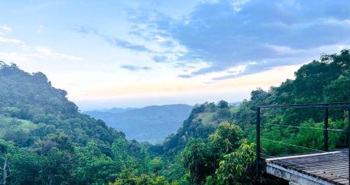 a room with a view of a mountain valley at Benjamin Cottage Haputale in Haputale