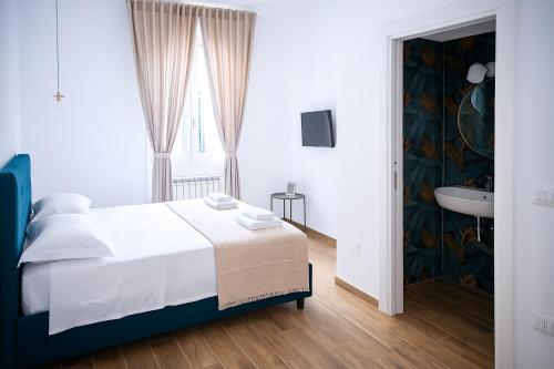 Postel nebo postele na pokoji v ubytování Dimora Diaz B&B