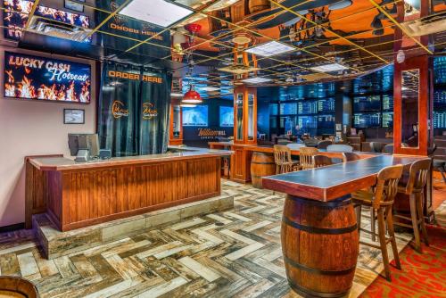 a bar with a table and chairs in a restaurant at The Federal Hotel Downtown Carson City, an Ascend Collection Hotel in Carson City