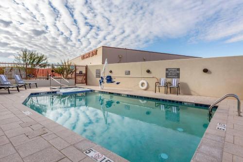 a swimming pool in front of a building at Comfort Suites Scottsdale Talking Stick Entertainment District in Scottsdale