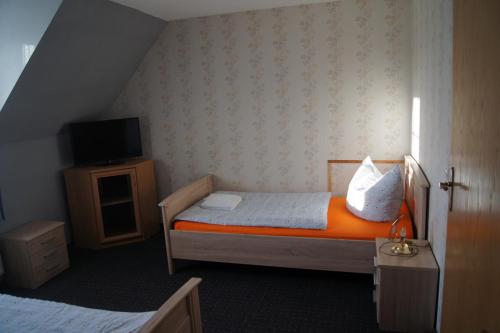 Lova arba lovos apgyvendinimo įstaigoje Hotel Draschwitz