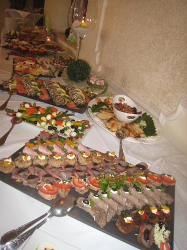 a table with many different types of food on it at Hotel Schöne Aussicht in Weißenfels