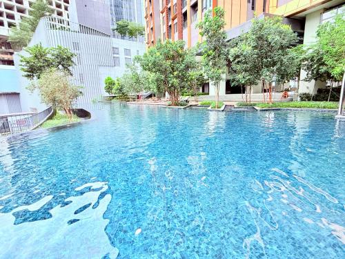 a large pool of blue water in a city at Luxury Lucentia Residence Bukit Bintang KLCC By IZ in Kuala Lumpur