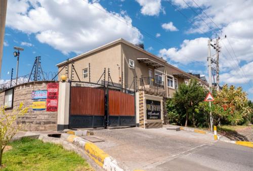 a building on the side of a street at Perfect Palm Condos-P2 in Nakuru