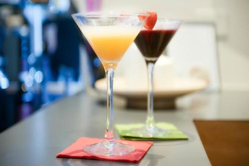 two cocktails sitting on a table with a red napkin at Best Western Ars Hotel in Rome