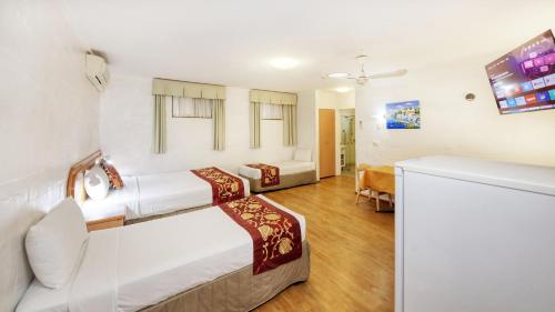 Postel nebo postele na pokoji v ubytování Espana Motel