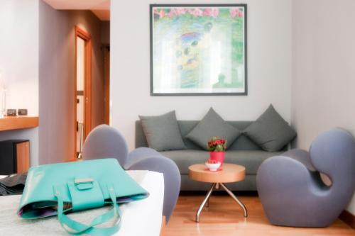 a living room with a couch and chairs at Best Western Ars Hotel in Rome