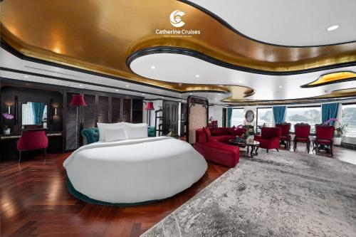a bedroom with a large white bed and red furniture at Catherine Cruise in Ha Long