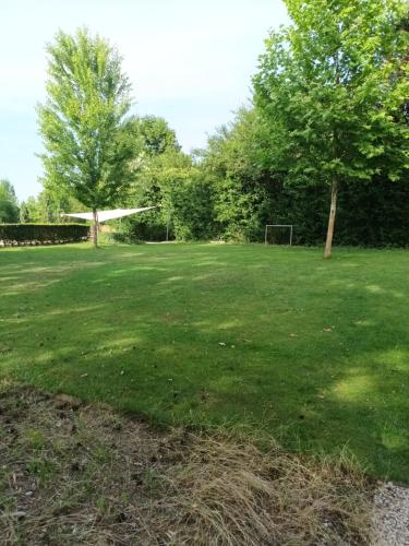 a large grassy field with a soccer goal at Apartmán Sĺňava rezort Linea Piešťany in Piešťany