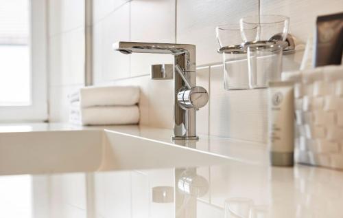 a bathroom sink with a faucet on a counter at Klosterschänke in Neukirchen beim Heiligen Blut