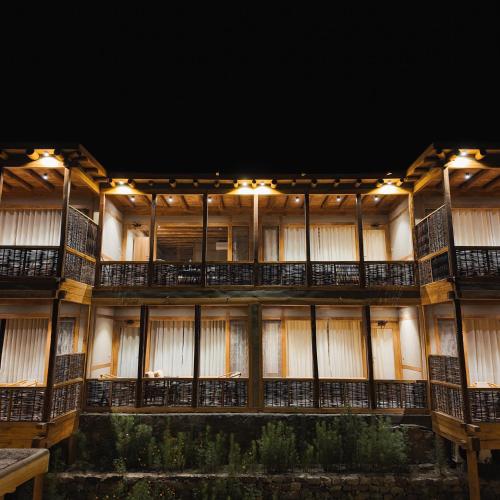 an exterior view of a building at night at Dera Lamsa Resort Shigar in Shigar