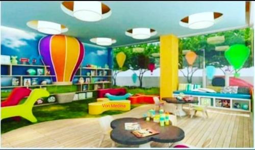 a childs room with a room with a balloon mural at Lafayette Park Square with balcony facing pool view in Cari Mayor