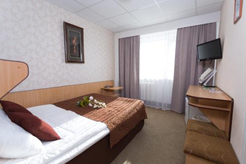 Postel nebo postele na pokoji v ubytování Toila Spa Hotel