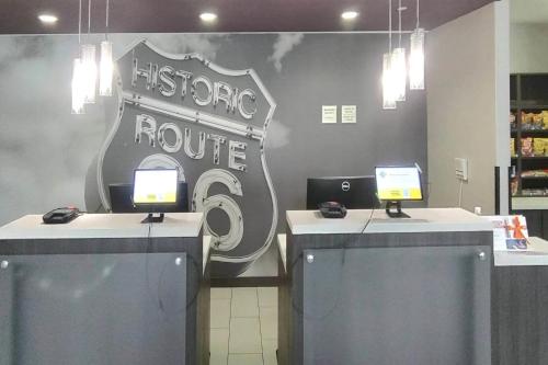 a store with two desks with two computers on them at Comfort Inn & Suites in Claremore