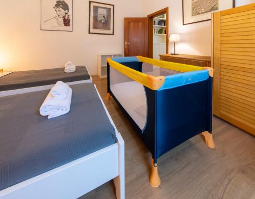 Postel nebo postele na pokoji v ubytování HouSmart Ognibene 2