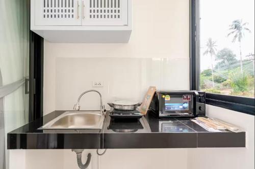 Nhà bếp/bếp nhỏ tại Tonjun Residences Chaweng