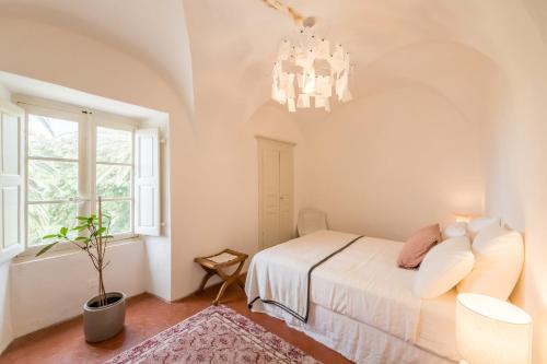 Postel nebo postele na pokoji v ubytování Appartement dans le Cap Corse - Canari