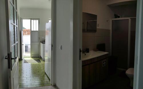 a bathroom with a sink and a toilet at Casa da Silveira in Angra do Heroísmo