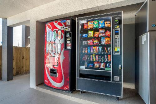 a cocacola soda vending machine in a building at Quality Inn Panama City North in Panama City