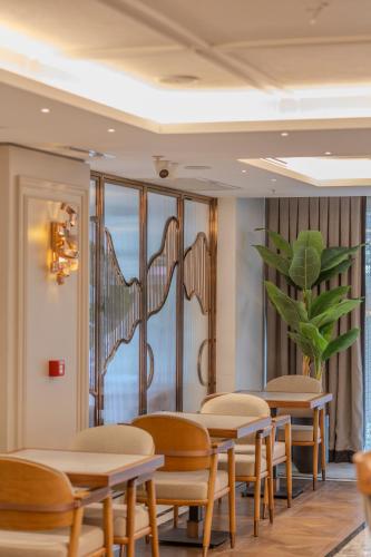 a row of tables and chairs in a waiting room at Grand Hilarium Hotel in Istanbul