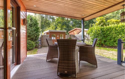 a patio with a table and chairs on a deck at Amazing Home In Erm With Wifi in Erm