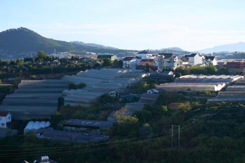 an aerial view of a small town with houses at Lotus Hotel Đà Lạt in Da Lat