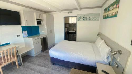 Postel nebo postele na pokoji v ubytování Le George Motel