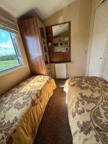 Ένα ή περισσότερα κρεβάτια σε δωμάτιο στο 6 berth Waterside Ingoldmells Skegness L35 SANTANAVAN 14