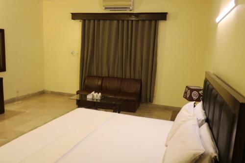 Postel nebo postele na pokoji v ubytování Mashwani Guest House