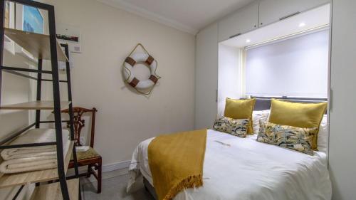 Ένα ή περισσότερα κρεβάτια σε δωμάτιο στο Driftwood beach house