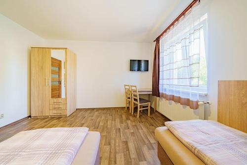 Letto o letti in una camera di Pension Krásno