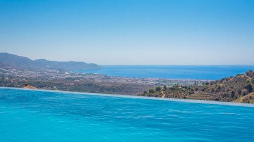 a large body of water with a city in the background at Villa Alborada Torrox by Ruralidays in Torrox