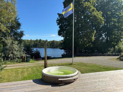 a bowl sitting on a wooden table with a flag at Villa Seeblick in Sjunnamåla