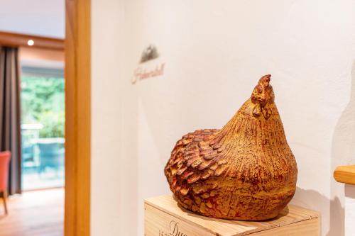a large shell sitting on top of a wooden table at Wein- und Klimahotel Bergfriedel in Bühlertal