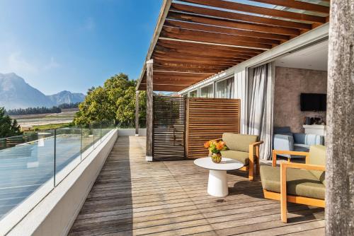a balcony with a view of the mountains at Clouds Estate in Stellenbosch