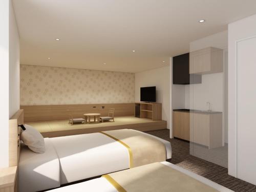 a bedroom with a large bed and a kitchen at Tosei Hotel Cocone Kamata in Tokyo