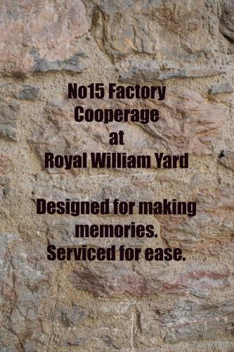 a sign on the side of a stone wall at No. 15 Factory Cooperage in Plymouth