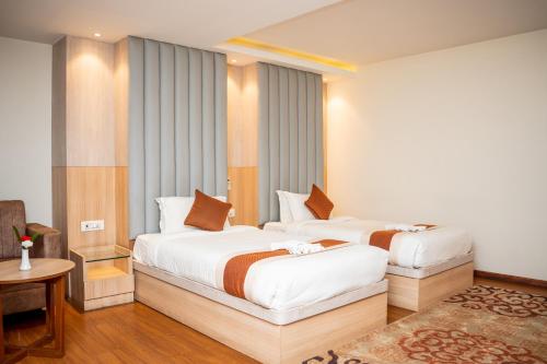 Postelja oz. postelje v sobi nastanitve Hotel Badrinath