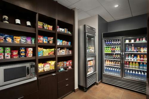 a grocery store with a refrigerator and a television at Courtyard by Marriott El Paso East/I-10 in El Paso