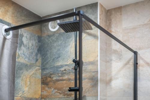 a shower with a glass door in a bathroom at Golfe Juan avec parking in Vallauris