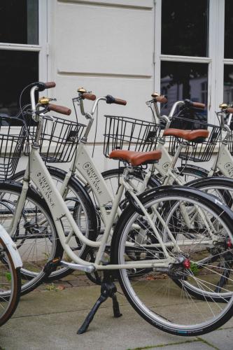 a group of bikes parked in front of a building at Hotel Skt. Annæ in Copenhagen