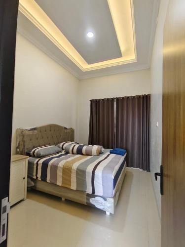 Katil atau katil-katil dalam bilik di Homestay Al Bayt syariah