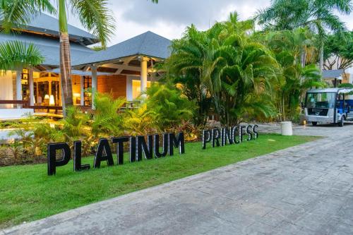 a sign in front of a building with palm trees at Grand Bavaro Princess - All Inclusive in Punta Cana