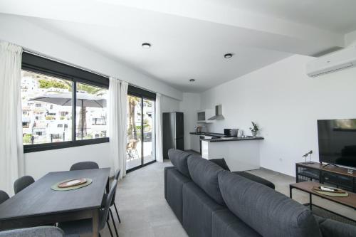 Televisyen dan/atau pusat hiburan di Apartamentos & SPA Torres de San Juan